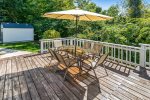 Large back deck with outdoor dining and gathering space